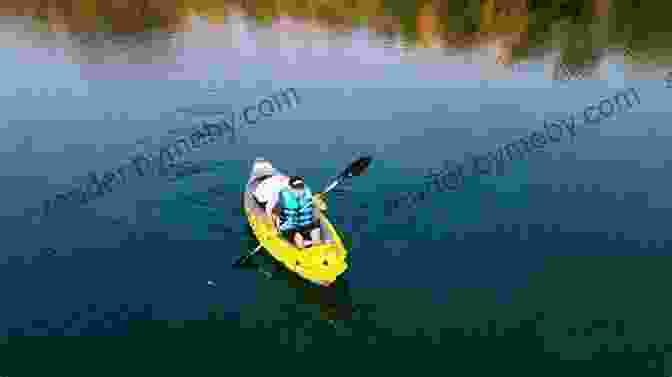 Kayaker Paddling Through A Tranquil Lake With Majestic Mountains In The Backdrop Don T Call Em Yaks 4: Perspective For The New Seasoned Kayaker