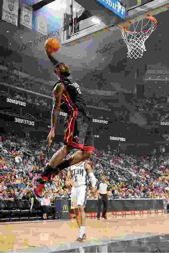 LeBron James Soaring Through The Air For A Dunk. Black History Leaders: Athletes: LeBron James Jackie Robinson Russell Wilson And Tiger Woods